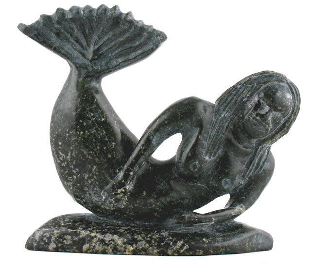 A dark, polished stone carving of a mermaid, in the style of folk art.
